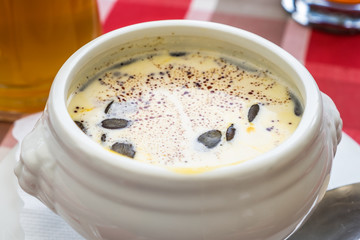 Pumpkin soup recipe in the white bowl for healthy food concept background