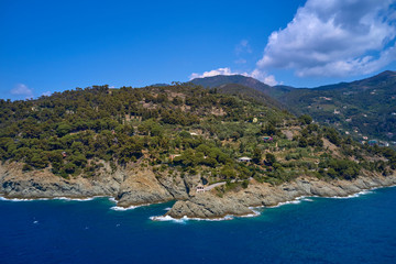 Sea waves hit the rocks. Bonassola, Italy.