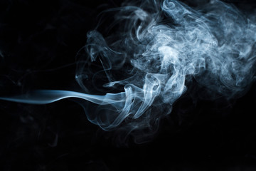 Photo of a wisp of smoke on a dark background