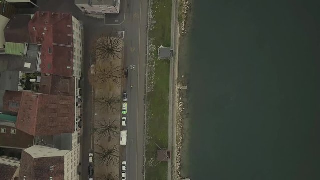 Flying over the side of the river Rhein in Basel, following a cyclist. Birdeyeflight.