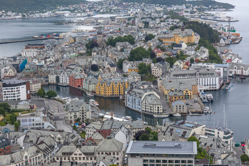 Alesund, Norway - June 12, 2016: Aerial view of Alesund cityscape and surroundings. View from the mountain Aksla at the city of Alesund, Norway. selective focus