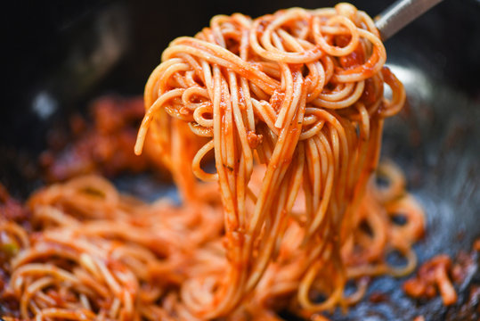 Spaghetti bolognese italian pasta in the restaurant italian food and menu concept - spaghetti on fork