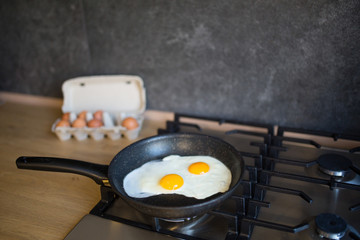  fried eggs on the stove