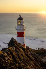 Tuinposter lighthouse at sunset © Tristan