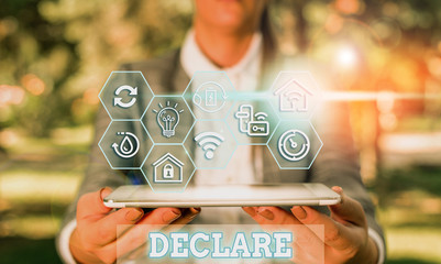 Writing note showing Declare. Business concept for make known or state clearly especially in...
