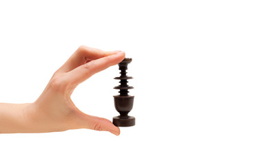 Hand with a chess figure on a white background