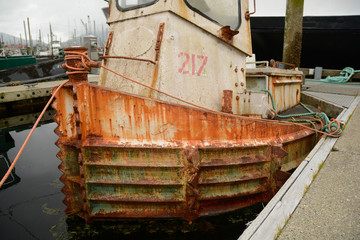 Fototapeta na wymiar Old, rusty boat in the harbor in Petersburg, Alaska