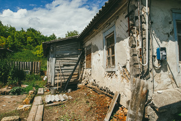 Fototapeta na wymiar an old village dilapidated house. The concept of abandonment and deprivation. Life in the village