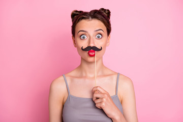 Portrait of funny teen girl hold mustache mask feel fun celebrate valentine summer day party send air kisses wear casual style outfit isolated over pastel color background