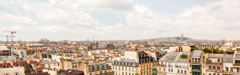 Fototapeta na wymiar Panoramic view, aerial skyline of Paris on city center, Sacre Coeur Basilica, churches and cathedrals, architecture, roofs of houses, streets landscape, Paris, France