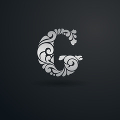 Decorative pattern letter G on black background