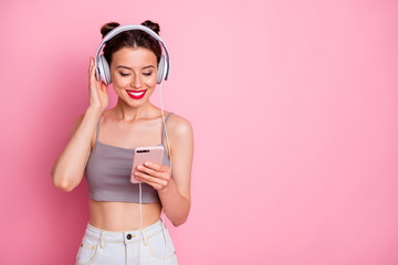 Portrait of charming youth girl use smartphone search radio songs summer listen music have headset...