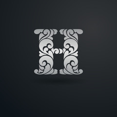 Decorative pattern letter H on black background