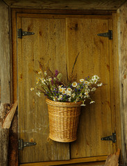 Hanger basket with flower at wood old hause