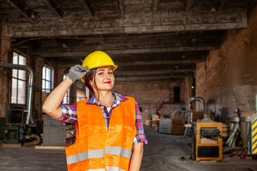 Girl looking proud working as an technician at plant