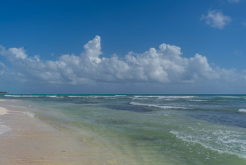 Caribbean sea coast. Blue sky with clouds and turquoise water. Travel photo, background, wallpaper. Copy space. Place for text. Yucatan. Quintana roo. Mexico.