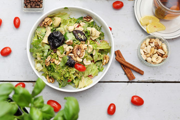  Salad with cashews and walnuts. Healthy vegetable diet, green lettuce.