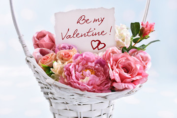 a basket of flowers for a Valentine