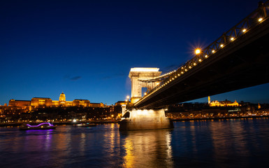 Hungarian Chain bridge, Royal palace and Danube river in Budapest at night