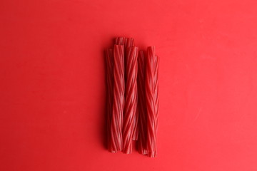 sweet red gummy licorice in color background
