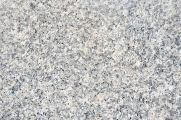 Real granite stone texture in top view. Natural material with gray abstract texture pattern of mineral, quartz. Smooth surface for decorative wall, floor, countertop, slab in bathroom and kitchen.