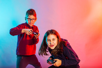 Emotional girl and boy playing virtual game © oksix