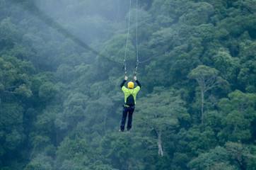 activity of tirolean over the mountain and forest