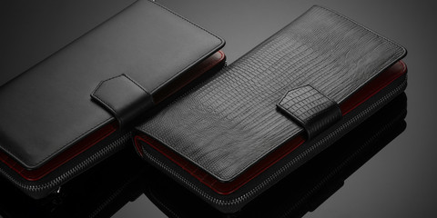 Fashionable leather men's wallet on a dark background