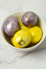 colored eggs on a white plate in a plate