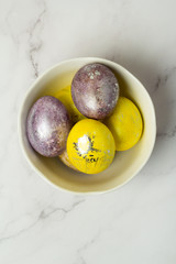 multi-colored eggs for easter on a white background top view