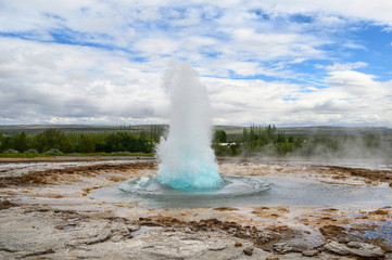 Erupting geysir Strokkur in Iceland