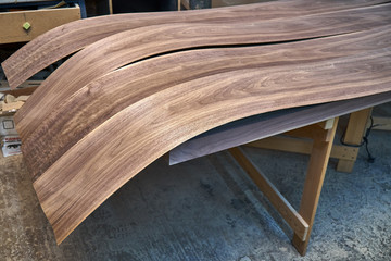 Walnut veneer. Wood texture. Woodworking and carpentry production.