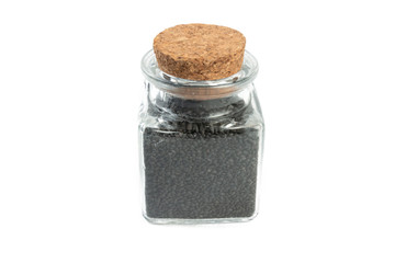 Basil seeds or Hairy, Sabja in a glass jar isolated on white background. spices and food ingredients