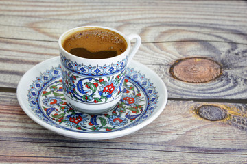 cup of Turkish coffee on wooden table
