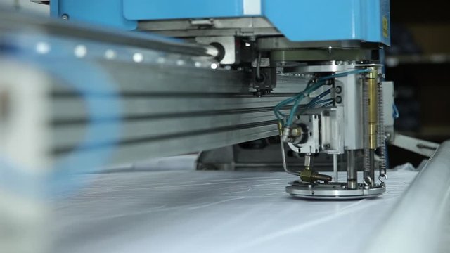 industrial machine for cutting fabrics, slider shot
