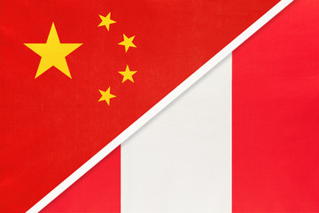 China or PRC vs Peru national flag from textile. Relationship between asian and american countries.