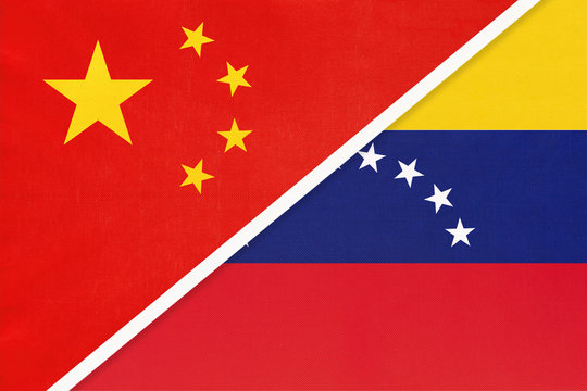China or PRC vs Venezuela national flag from textile. Relationship between asian and american countries.