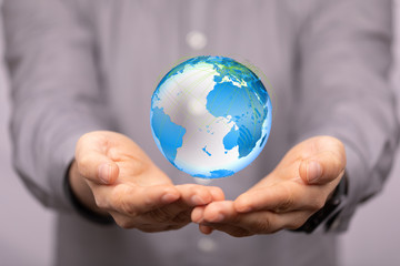 Human Hand Holding The World In Hands.