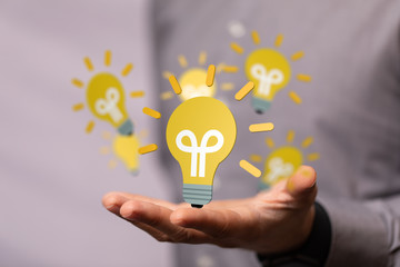 idea lamp concept in hand.