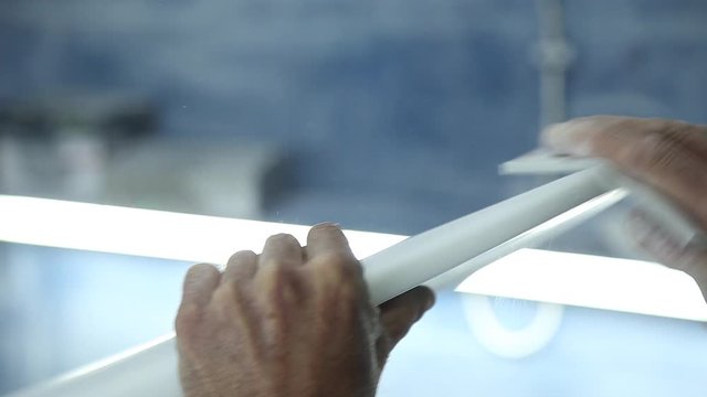 working on handmade surfboard