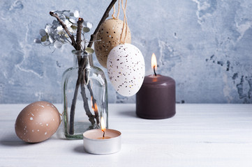 Brown eggs and lit candles