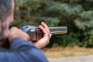 Male hunter ready to hunt with hunting rifle.hunter Holds a rifle.