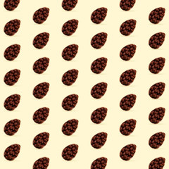 Card for Happy Easter celebrating or greeting. Chocolate eggs on yellow background. Modern artwork, bright wallpaper, background, pattern for your device, design or advertisement. concept. Egg hunt.