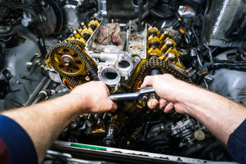 Car repair: overhaul of the V6 engine with detailed pulleys and parts.