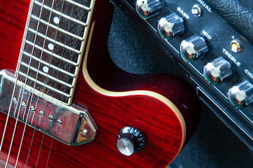 Close-up of guitar and amplifier.