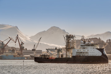 ULSTEINVIK, NORWAY - 2018 FEBRUARY 28. Island Constructor in the fjord of Ulsteinvik, and you can...