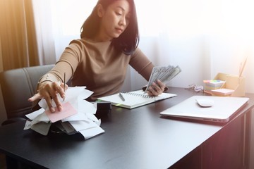 Asian woman is clear, manage for expenses, it's important of account and finance of company. By...