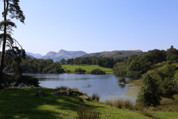 Loughrig Tarn. Paddleboard fun in natures' beautiful surroundings