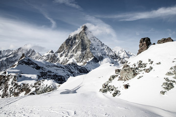 Fototapeta na wymiar view of Matterhorn peak against blue sky Swiss Alps