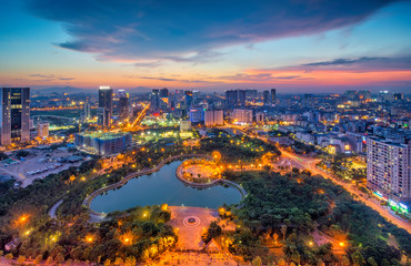 Hanoi skyline cityscape at twilight period. Cau Giay park, west of Hanoi - obrazy, fototapety, plakaty